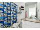 This bathroom features a modern vanity with sink and a shower with a themed curtain at 17470 E 95Th Pl, Commerce City, CO 80022