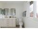 Bright bathroom with double sinks, modern fixtures, and a large window at 5292 Lichen Pl, Boulder, CO 80301