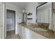 Bright bathroom with double sinks, granite counters, and minimalist modern decor at 5292 Lichen Pl, Boulder, CO 80301