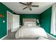This cozy bedroom features a padded headboard, a ceiling fan, and neutral tones at 5292 Lichen Pl, Boulder, CO 80301