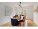 Dining room with a wooden table, modern chandelier, and access to the outdoor patio at 5292 Lichen Pl, Boulder, CO 80301