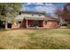 Beautiful brick front exterior with a well manicured lawn at 5292 Lichen Pl, Boulder, CO 80301