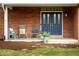 Inviting front porch with rocking chairs and a view of the lawn at 5292 Lichen Pl, Boulder, CO 80301