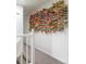 A colorful wall decoration made of origami cranes leads down the hallway at 5292 Lichen Pl, Boulder, CO 80301