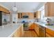 Kitchen with stainless appliances, hardwood floors, quartz countertops, and wood cabinets at 5292 Lichen Pl, Boulder, CO 80301