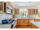 Well-lit kitchen with stainless steel appliances and white tile backsplash at 5292 Lichen Pl, Boulder, CO 80301