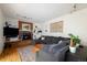 Cozy living room features a brick fireplace, plush seating, and built-in shelving at 5292 Lichen Pl, Boulder, CO 80301