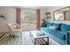 Comfortable living room with a bright window and a cozy seating arrangement and plush blue sofa at 5292 Lichen Pl, Boulder, CO 80301