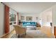 Stylish living room with a large window, plush chair, and comfortable sofa at 5292 Lichen Pl, Boulder, CO 80301