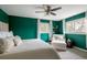Serene main bedroom with an accent wall, bright windows, and a cozy reading nook with comfy furniture at 5292 Lichen Pl, Boulder, CO 80301