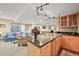 Open basement featuring a bar, kitchenette, entertainment area and comfortable furnishings at 6105 W Long Dr, Littleton, CO 80123