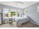 Bright bedroom featuring three large windows offering plenty of natural light at 6105 W Long Dr, Littleton, CO 80123
