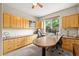 Well-lit home office with ample storage, a large window, and a built-in desk area at 6105 W Long Dr, Littleton, CO 80123