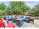 Relaxing patio featuring cushioned seating, a decorative rug, and two cozy gas fire pits for outdoor enjoyment at 6105 W Long Dr, Littleton, CO 80123