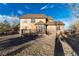 Backyard view featuring a deck and patio area, ideal for outdoor enjoyment at 1120 Antelope W Dr, Bennett, CO 80102