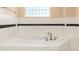 The bathroom features a luxurious soaking tub, perfect for unwinding after a long day at 1120 Antelope W Dr, Bennett, CO 80102