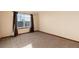 This spacious bedroom features neutral walls, carpet and a window to let in natural light at 1120 Antelope W Dr, Bennett, CO 80102