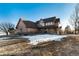 Inviting two-story home with a welcoming porch and mature trees on a spacious lot, perfect for serene living at 1120 Antelope W Dr, Bennett, CO 80102
