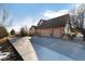Spacious home with a wide driveway leading to a three-car garage at 1120 Antelope W Dr, Bennett, CO 80102