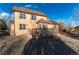 Two-story house with brown siding and large deck at 1120 Antelope W Dr, Bennett, CO 80102