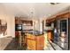 Gourmet kitchen with a large island, granite countertops, stainless steel appliances, and ample cabinet space at 1120 Antelope W Dr, Bennett, CO 80102