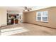 Bright living room flows into a modern kitchen featuring stylish countertops and sleek, stainless steel appliances at 1120 Antelope W Dr, Bennett, CO 80102