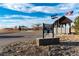 Park entrance with signage and American and Colorado flags at 1120 Antelope W Dr, Bennett, CO 80102