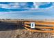 Trailhead entrance with wooden fence and a blue trailhead sign at 1120 Antelope W Dr, Bennett, CO 80102