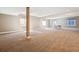 Large basement with neutral carpet, multiple windows, and ample open space at 24322 E Mineral Dr, Aurora, CO 80016