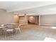 Expansive basement with neutral carpet, a small table with chairs, and natural light at 24322 E Mineral Dr, Aurora, CO 80016