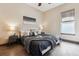 Bedroom with a dark bed and hardwood floors at 24322 E Mineral Dr, Aurora, CO 80016
