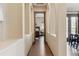 Hallway with decorative niches leading to the bedroom and dining area at 24322 E Mineral Dr, Aurora, CO 80016