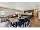 Open concept living room and dining area with dark wood floors at 24322 E Mineral Dr, Aurora, CO 80016
