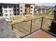 Balcony overlooking garden, with metal railing and wood decking at 2879 W Parkside Pl, Denver, CO 80221
