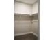 Neutral, reach-in closet with a shelf and bar for hanging clothes at 2879 W Parkside Pl, Denver, CO 80221