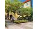 Residential courtyard featuring native plants, hopscotch painted on pavement, and multiple seating areas at 2879 W Parkside Pl, Denver, CO 80221