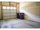 Attached garage with ample space for two cars and additional storage, featuring an automatic door at 2879 W Parkside Pl, Denver, CO 80221