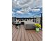 Expansive rooftop deck with lounge seating and vibrant floral accents, perfect for relaxing and entertaining at 2879 W Parkside Pl, Denver, CO 80221