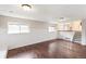 Basement with two windows letting in natural light and wood-look flooring throughout at 16652 E Gunnison Pl, Aurora, CO 80017