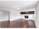 Finished basement featuring modern flooring and a charming fireplace with white brick surround at 16652 E Gunnison Pl, Aurora, CO 80017