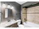 A full bathroom with a shower-tub combination and tile surround at 16652 E Gunnison Pl, Aurora, CO 80017