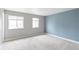 Spacious bedroom with two large windows and soft carpeting, providing a serene atmosphere at 16652 E Gunnison Pl, Aurora, CO 80017