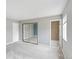 Bright bedroom featuring a walk-in closet with mirrored doors and an en-suite bathroom at 16652 E Gunnison Pl, Aurora, CO 80017
