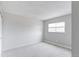 Neutral bedroom with plush carpeting and ample natural light from single, large window at 16652 E Gunnison Pl, Aurora, CO 80017