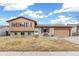 Charming two-story home with a well-manicured lawn and a welcoming front porch at 16652 E Gunnison Pl, Aurora, CO 80017