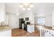 Updated kitchen boasts granite countertops, sleek black appliances, and ample white cabinetry at 16652 E Gunnison Pl, Aurora, CO 80017
