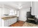 Efficient kitchen with granite counters, stainless dishwasher and ample storage in bright white cabinets at 16652 E Gunnison Pl, Aurora, CO 80017