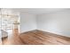 Bright living room showing open floor plan, hardwood floors, and access to the kitchen at 16652 E Gunnison Pl, Aurora, CO 80017