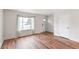 Inviting living room with bright window, modern floors, and front door at 16652 E Gunnison Pl, Aurora, CO 80017