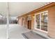 Covered patio area with sliding glass door and built in shelving at 16652 E Gunnison Pl, Aurora, CO 80017